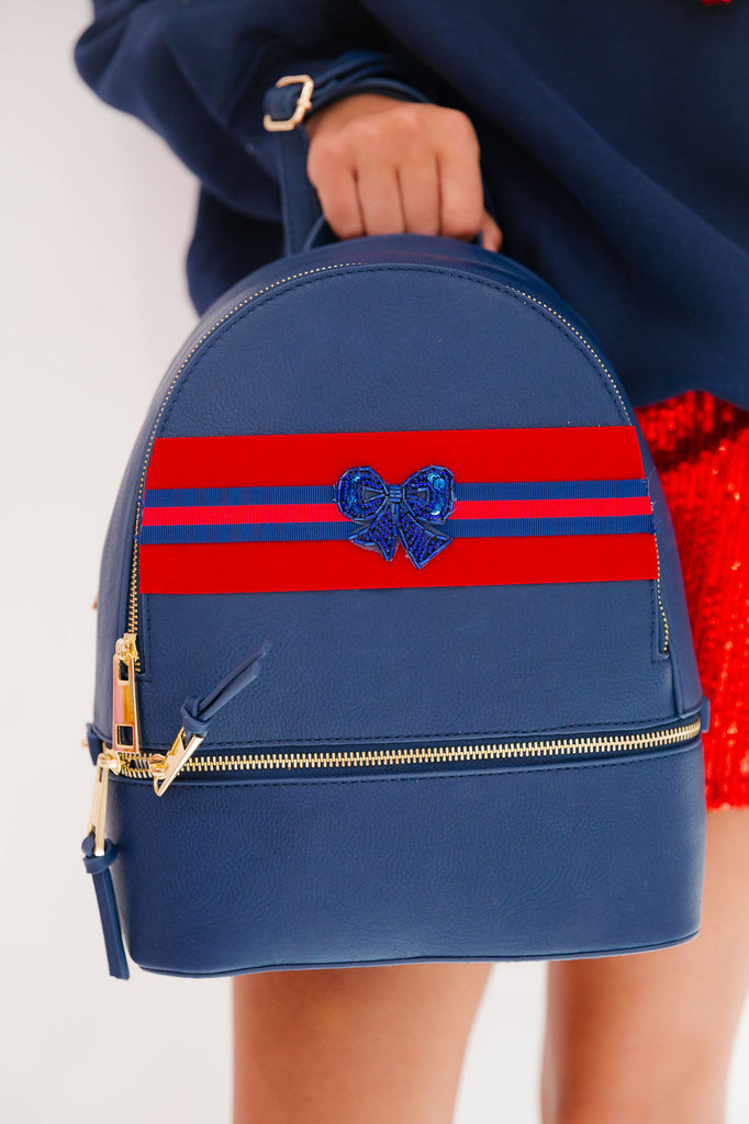 HOLIDAY BOW NAVY BACKPACK BACKPACK Judith March   