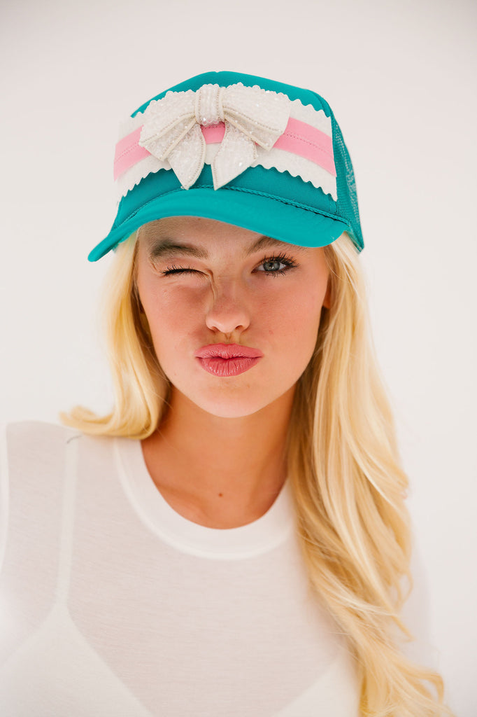 PUT A BOW ON IT TRUCKER HAT HAT Judith March